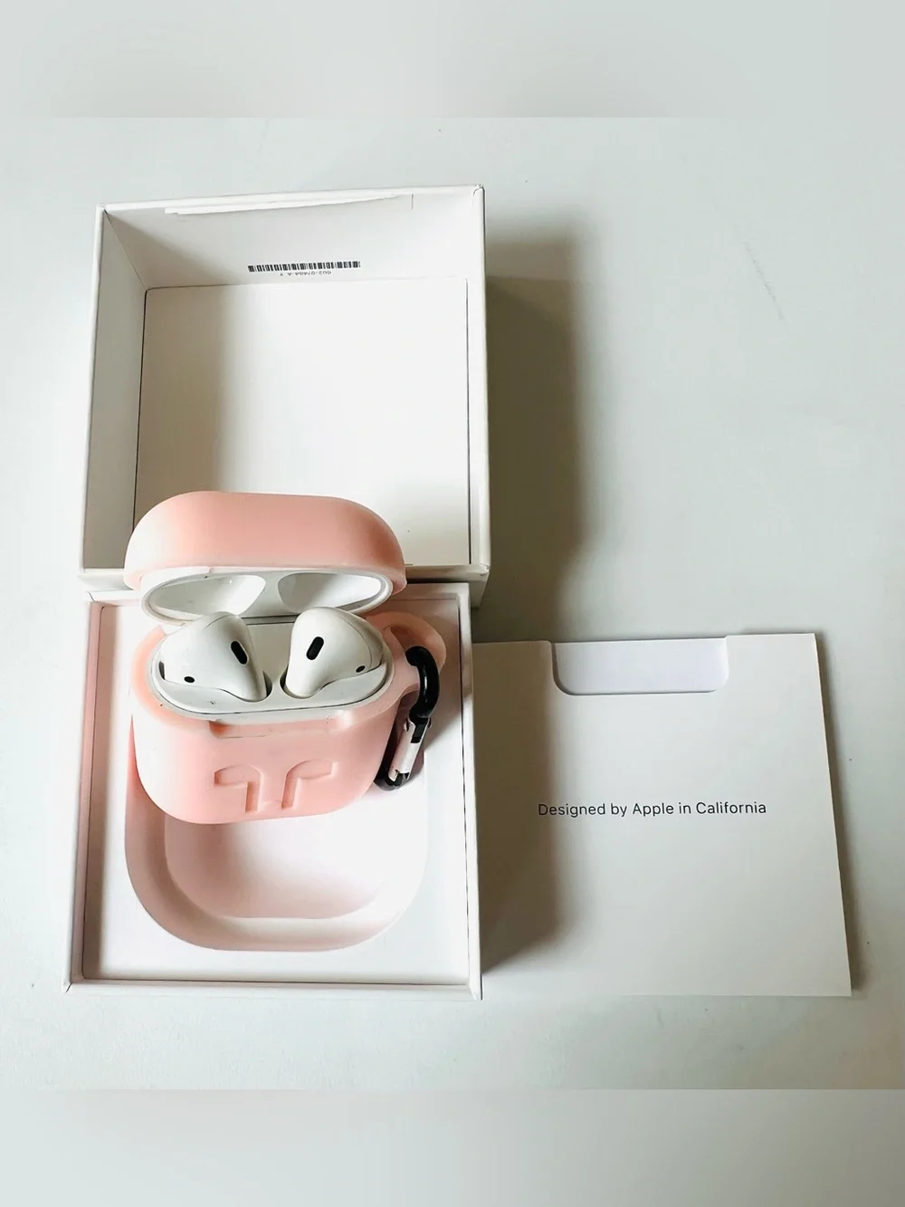 Apple AirPods with Pink Silicone Case and Carabiner in Working Conditions Like N